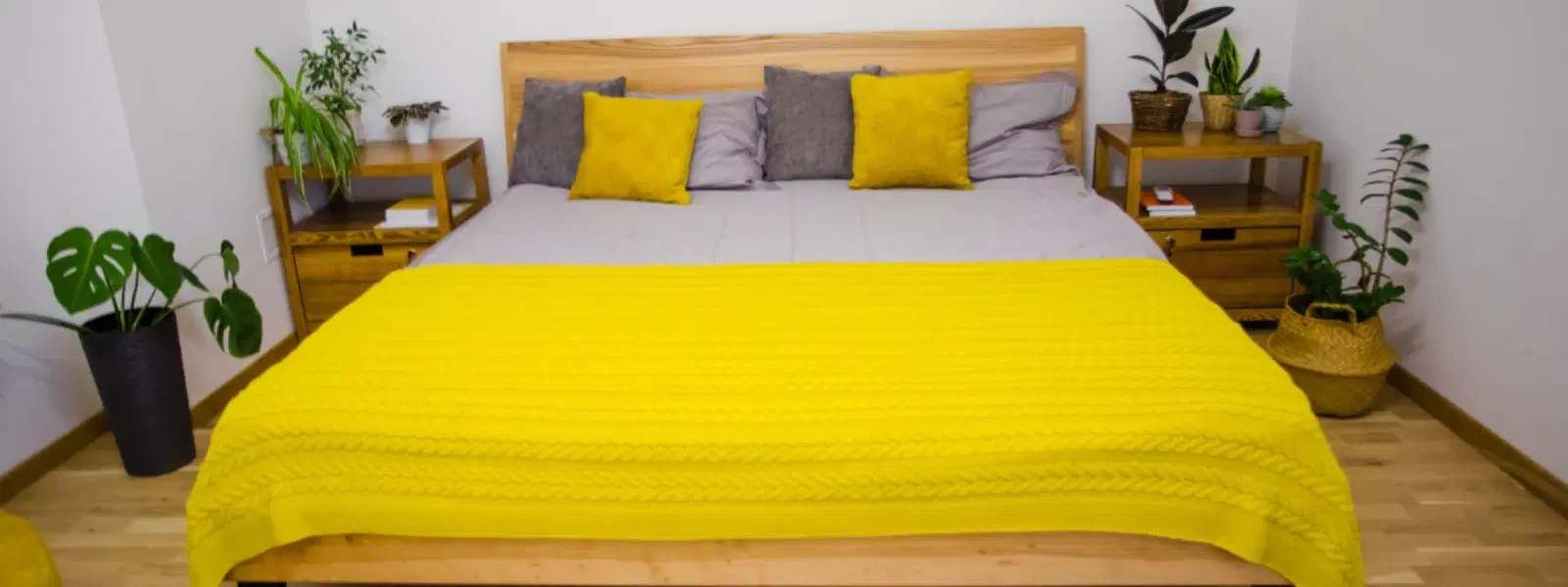 A softly lit room with cushions and a warm blanket arranged for a quiet relaxation routine